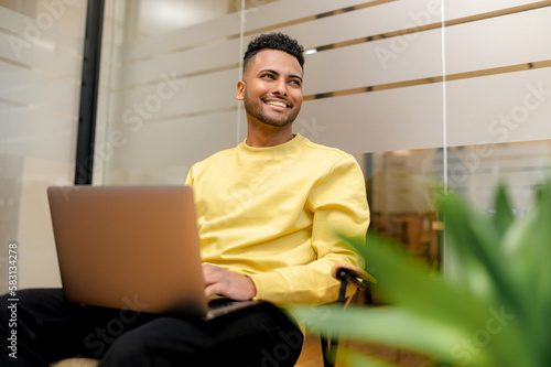 Photography Cheerful determined young bearded male student of freelancer, office worker in c