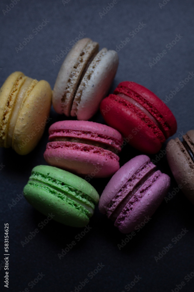 colorful macaroons on wooden table colorful macaroons on wooden table