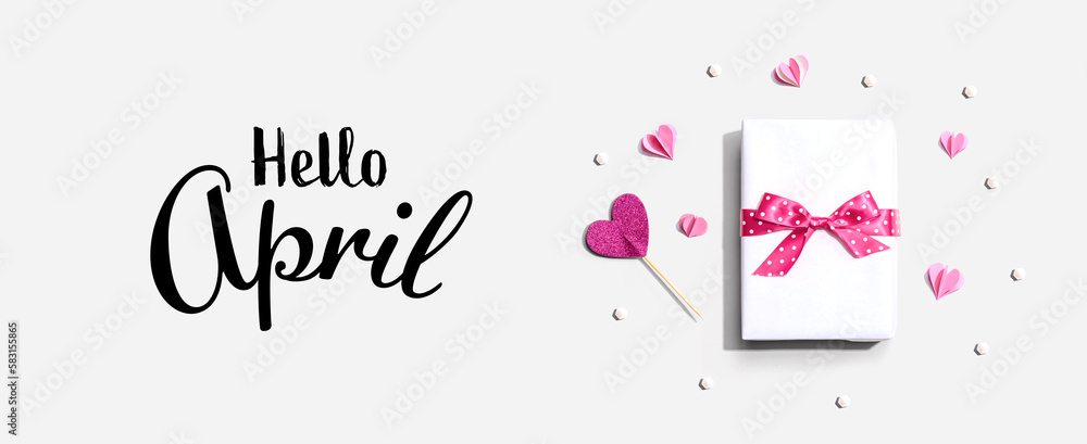 Hello April message with a gift box and paper hearts Hello April message with a gift box and paper hearts