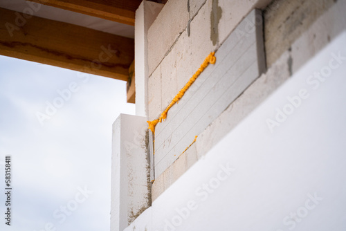 The process of insulating the walls of a polystyrene house. Reducing heat loss in winter and preparing for a cold snap. Universal thermal insulation material