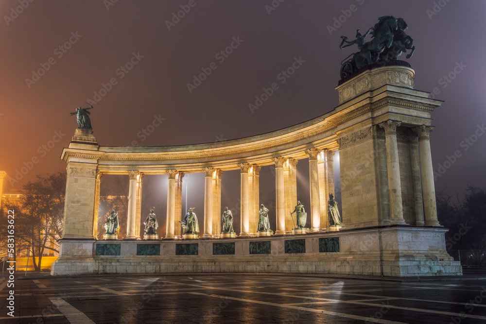Budapest, Hungary illuminated night view of Heroes Square, Hosok Tere, with statues of national leaders.