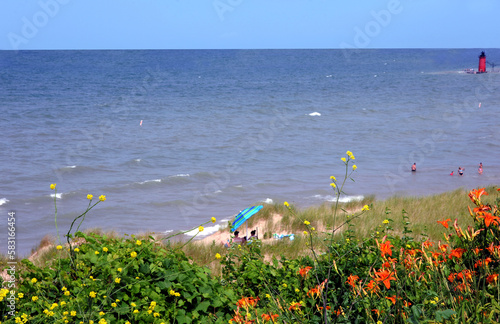 Beach Goers Enjoy South Haven Lighthouse photo