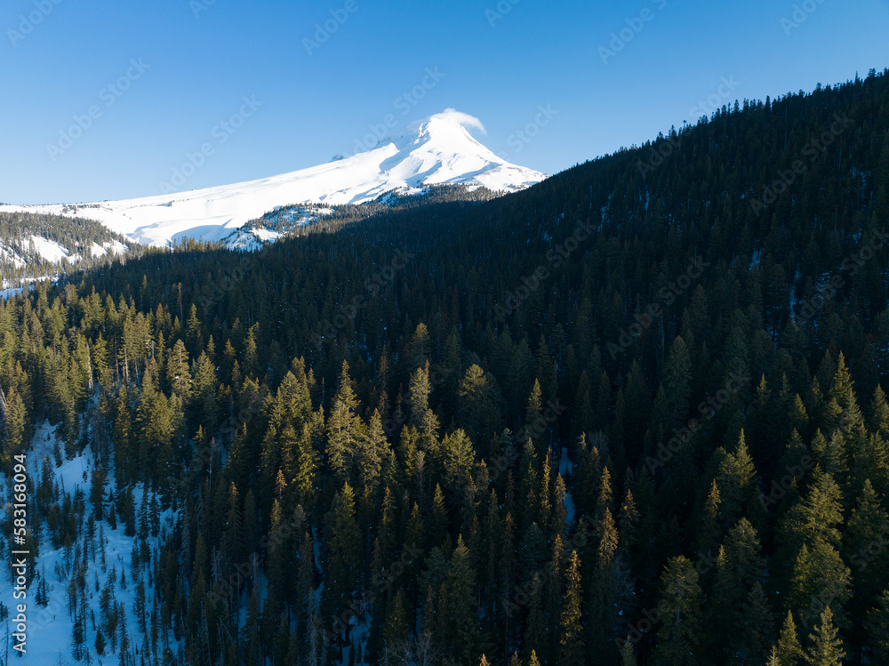 Snow covers Mt Hood, a beautiful stratovolcano found about 50 miles southeast of Portland, Oregon. Mt Hood has one of the longest ski seasons in the U.S. due to its annual snow pack.