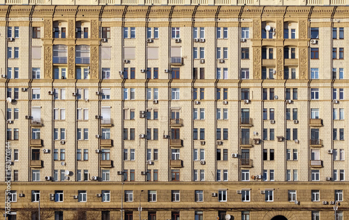 Photography Urban residential stalinist building wall with lot of windows front view close u