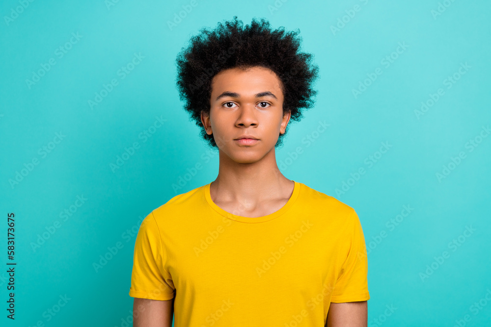 Portrait of focused concentrated young person look camera isolated on vibrant aquamarine color background