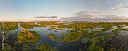 Aerial panoramic sunset sunrise scene at swamps and wetlands of Big Creek National Wildlife Area near Long Point Provincial Park, Lake Erie shore. photo