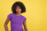 Woman with afro hair smiling at camera