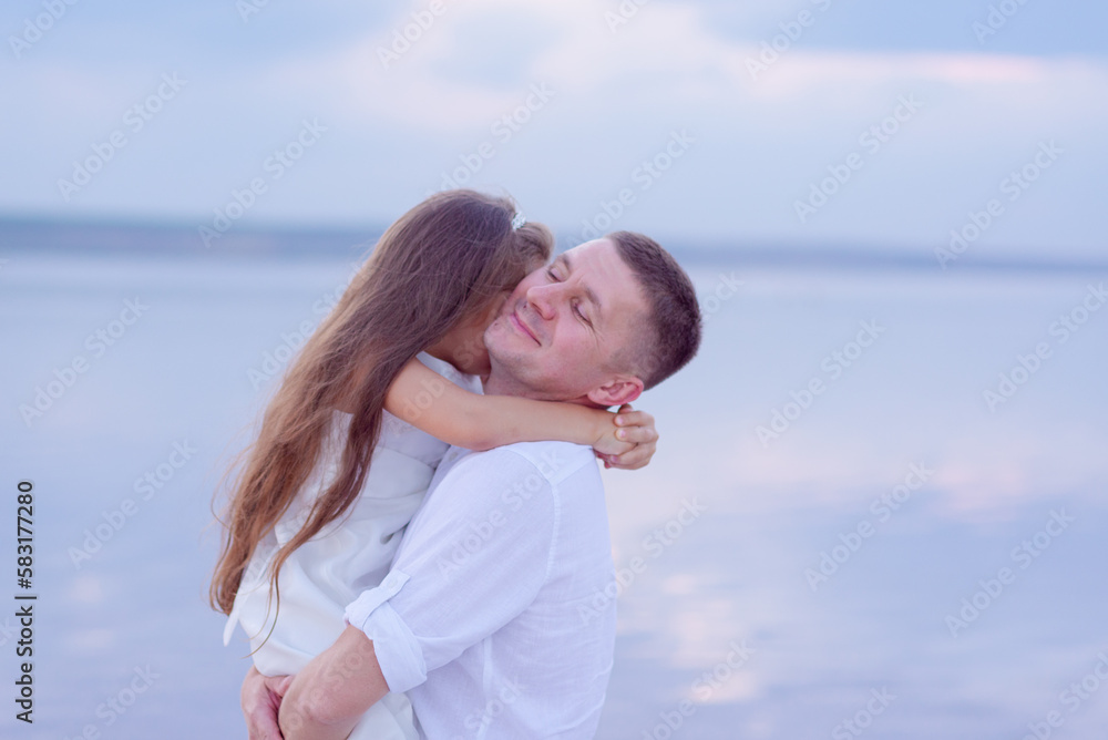 Happy father spending fun time with his little daughter at the beach. father's day Happy father spending fun time with his little daughter at the beach. father's day