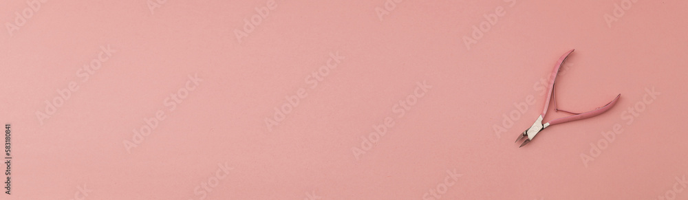 Fototapeta premium Banner with nail clippers for manicures