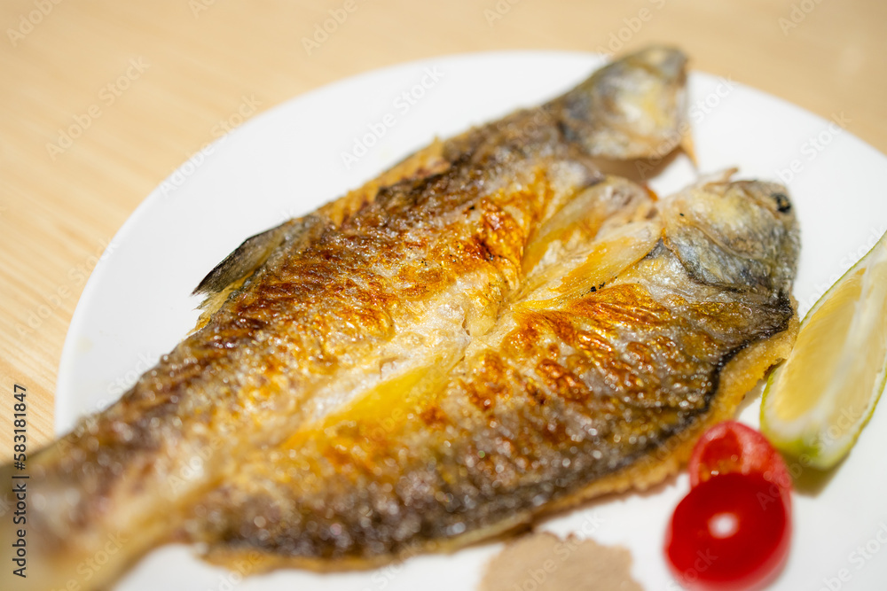 Delicious grill fish dish in restaurant Delicious grill fish dish in restaurant