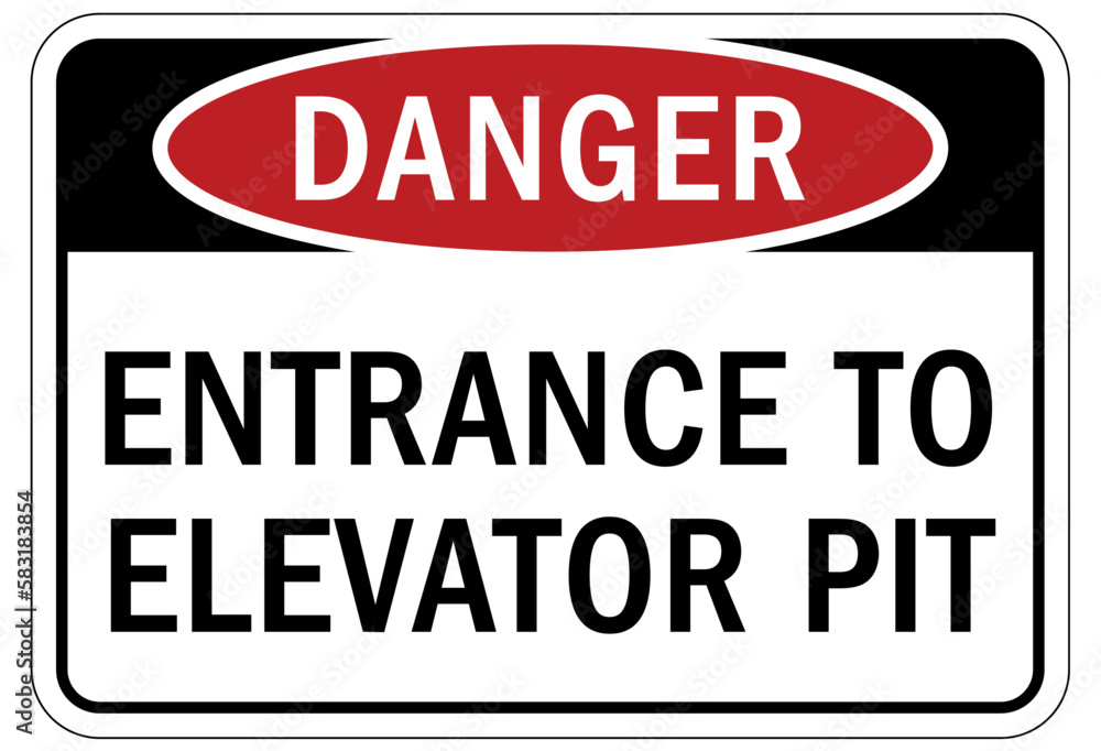 Elevator warning sign and labels entrance to elevator pit