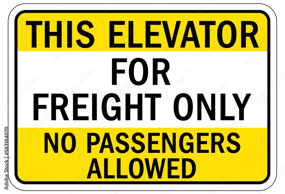 Elevator warning sign and labels this elevator for freight only. No passengers allowed