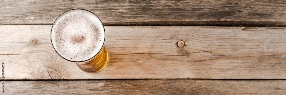 Beer glass on wooden table. Close up Beer glass on wooden table. Close up