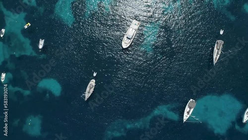Vista cenital de barcos fondeados sobre aguas cristalinas (Ibiza) photo