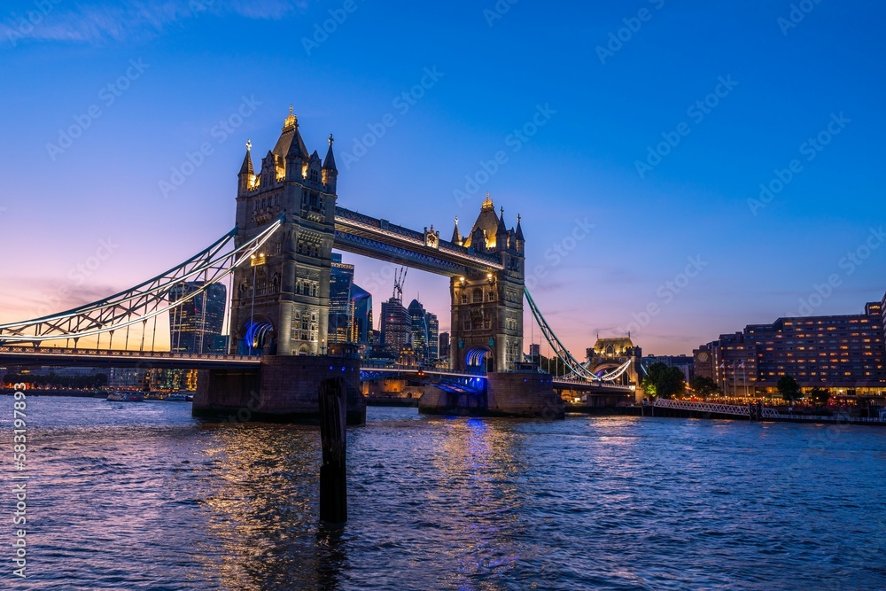 Scenic shot of the Tower Bridge and the city skyline in London, Europe during dusk