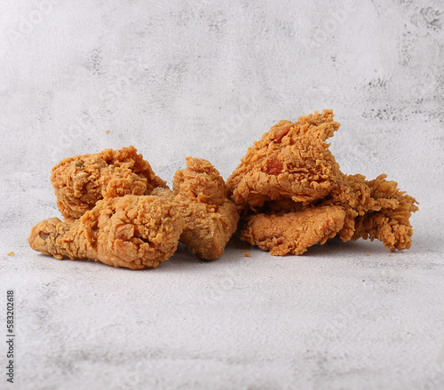 Crispy broasted chicken on a white background