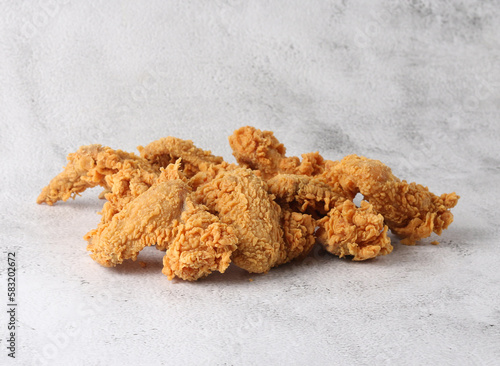 Crispy broasted chicken on a white background