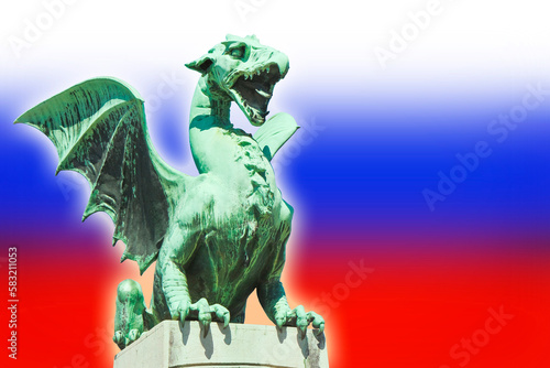 Ljubljana dragon on a dragon bridge: the symbol of the city and the nation - concept image with the slovenian flag on background photo