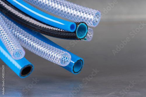 Bunch of flexible water and air hose pipe photo