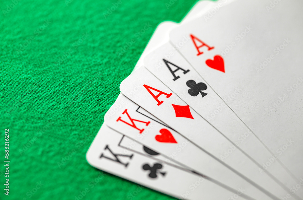 Playing cards, poker combination full house, three aces and two kings cross hearts diamonds suits Playing cards, poker combination full house, three aces and two kings cross hearts diamonds suits