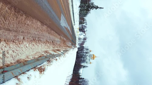 Belogorsky St. Nicholas Orthodox Missionary Monastery. Russia, Perm Krai, Belaya Gora. The temple on the hill in winter. Monastery on the background of snow. 4K photo