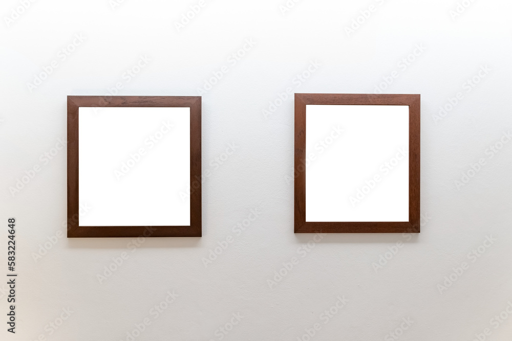 Blank wooden picture frames on concrete wall Blank wooden picture frames on concrete wall