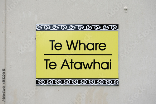 Te Whare Te Atawahi Maori and English Sign at local school in Waikato, Aotearoa, New Zealand photo