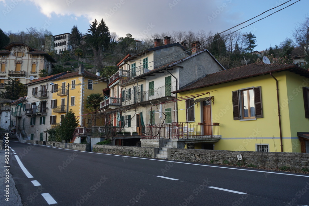 street in town with colorful building by lake Maggiore, Ticino