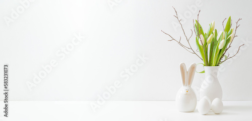 Photography White spring tulips in a vase, easter eggs on a white table