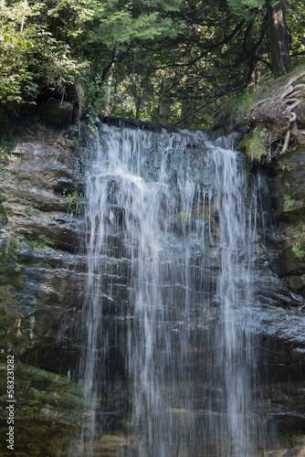 Waterfall outdoors over rocks © Allen Penton
