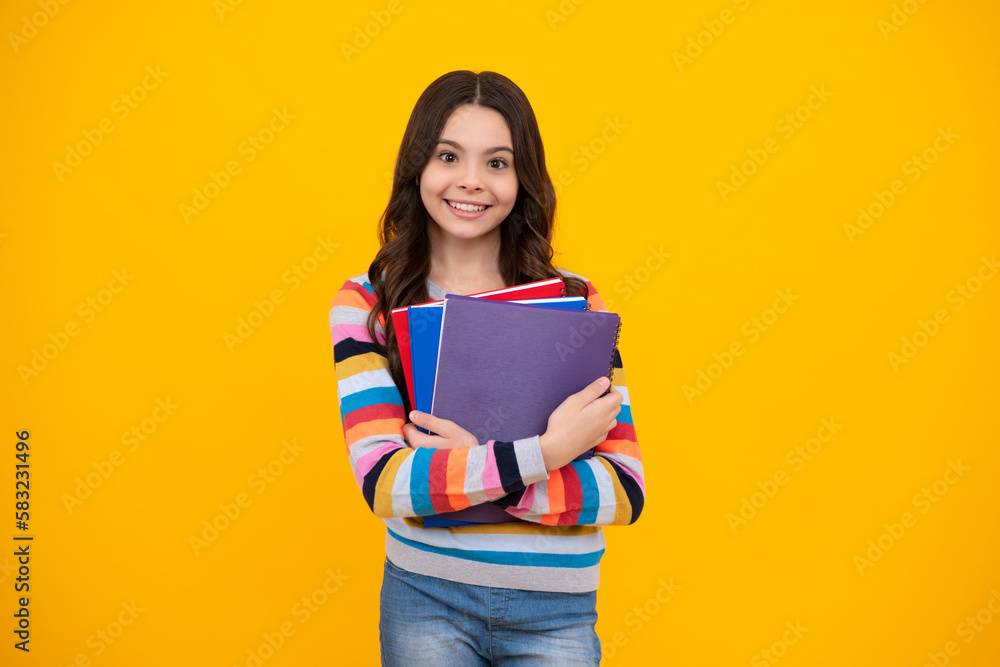 School child with book. Learning and education. Happy teenager, positive and smiling emotions of teen schoolgirl. School child with book. Learning and education. Happy teenager, positive and smiling emotions of teen schoolgirl.