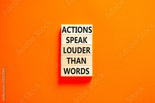 Actions speak louder words symbol. Concept words Actions speak louder than words on wooden blocks. Beautiful orange table orange background. Business new mindset for results concept. Copy space.
