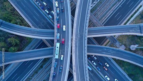 Aerial drone top down photo of modern Attiki Odos toll multilevel interchange highway with National road in Attica area at sunset, Athens, Greece