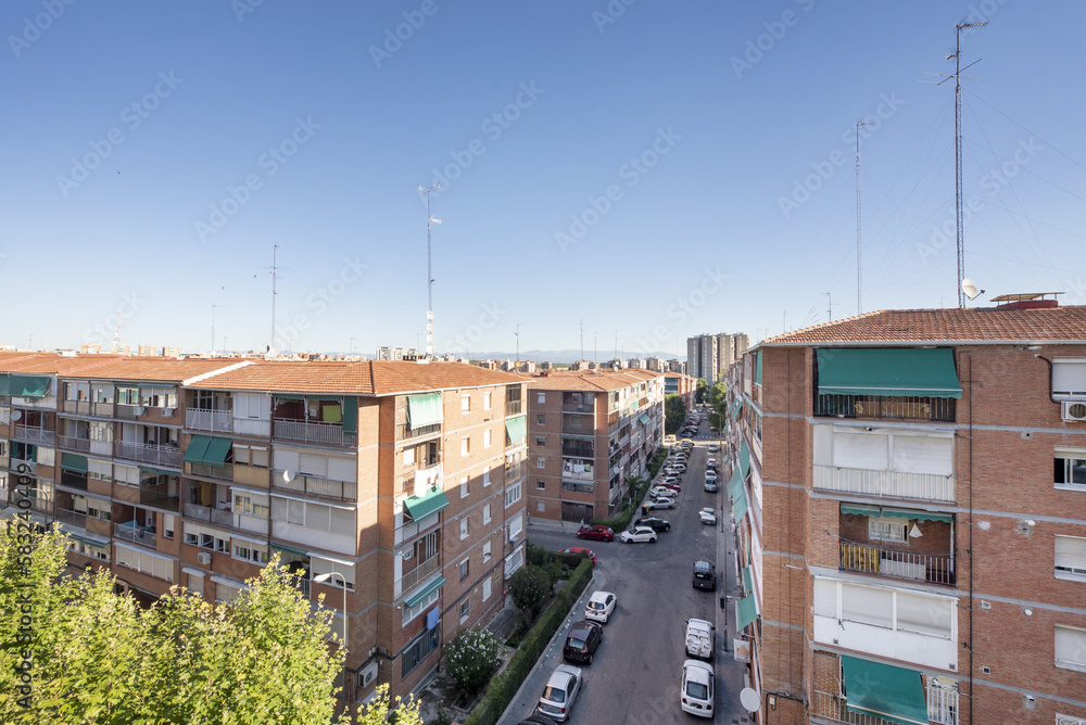 Fototapeta premium Blocks of brick buildings intended for residential housing of a modest character in a neighborhood of the city