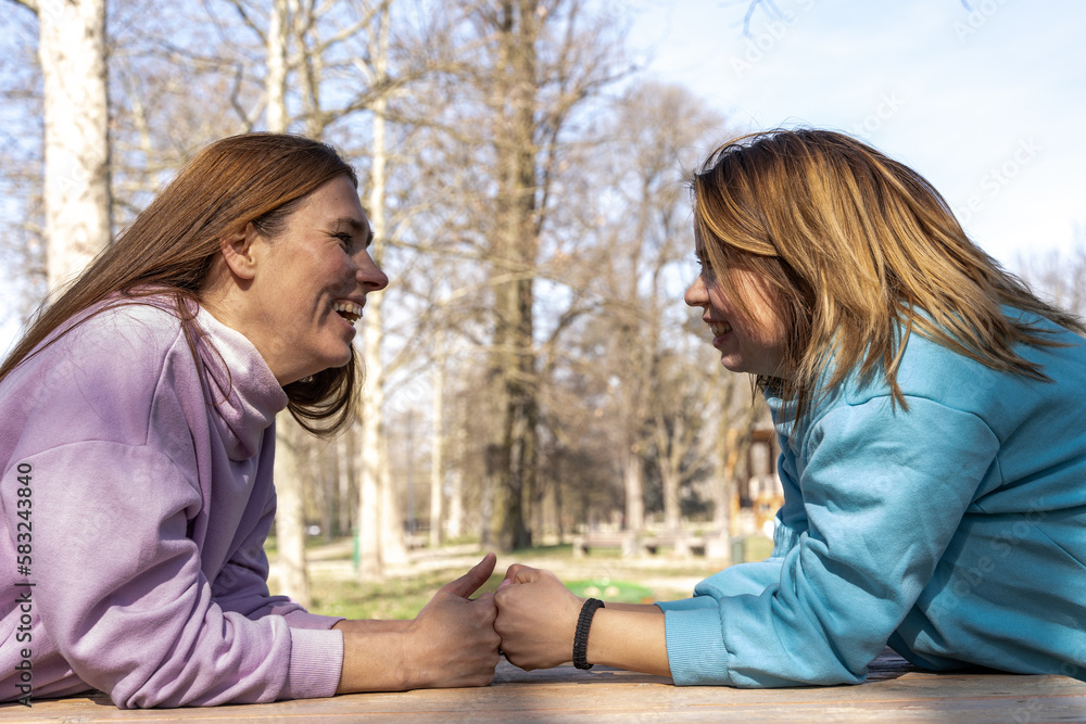 portrait of female athlete couple having fun while relaxing outdoors portrait of female athlete couple having fun while relaxing outdoors