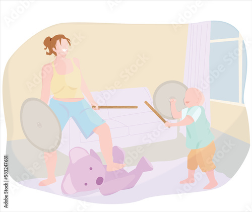 MADRE E HIJO CAUCÁSICOS JUGANDO A LAS LUCHAS CON OSO DE PELUCHE
