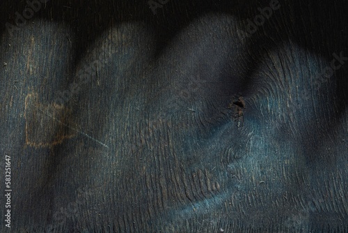 Plywood is a destroyed wood layer. Dark wood background - abstract pattern of cracks