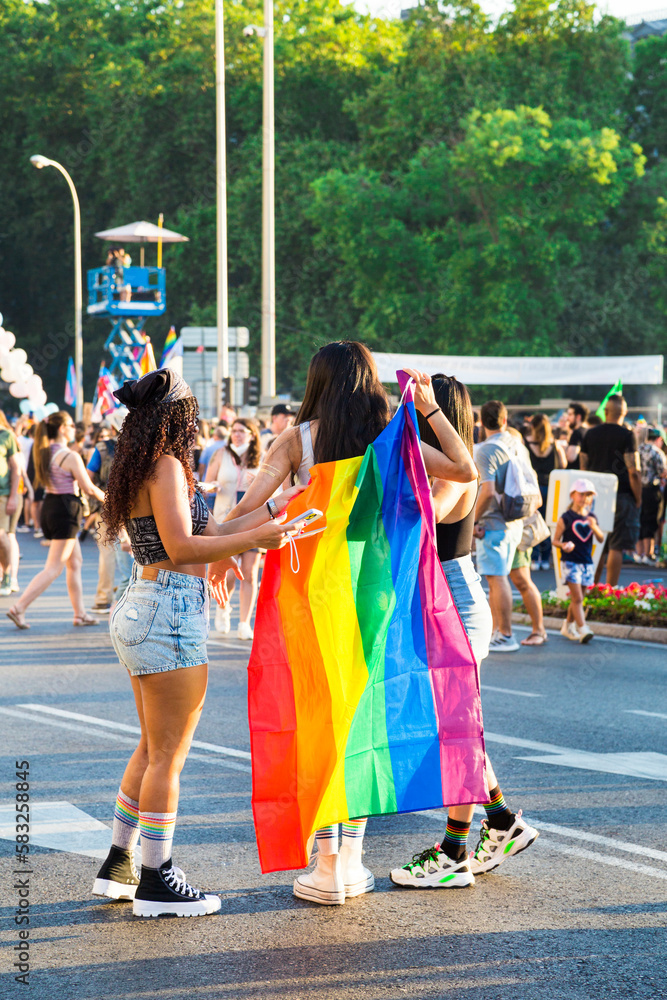 Group of friends dressed in the pride flag at the Pride. Women supporting freedom and equality.