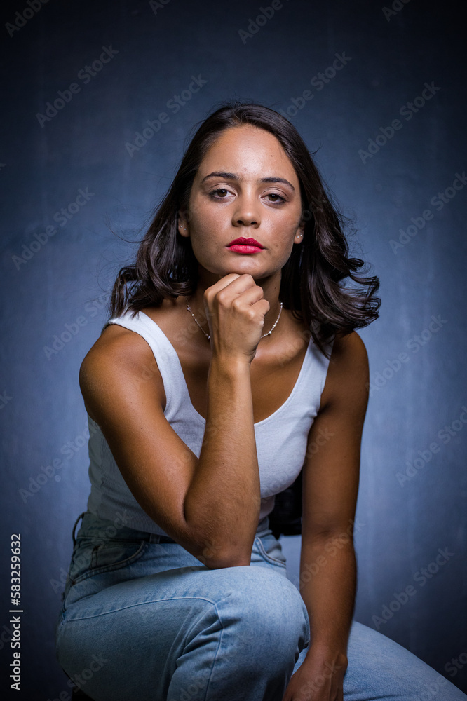 Close up image of a Dark Haired Girl Posing for a Fashion Shoot in a studio Close up image of a Dark Haired Girl Posing for a Fashion Shoot in a studio