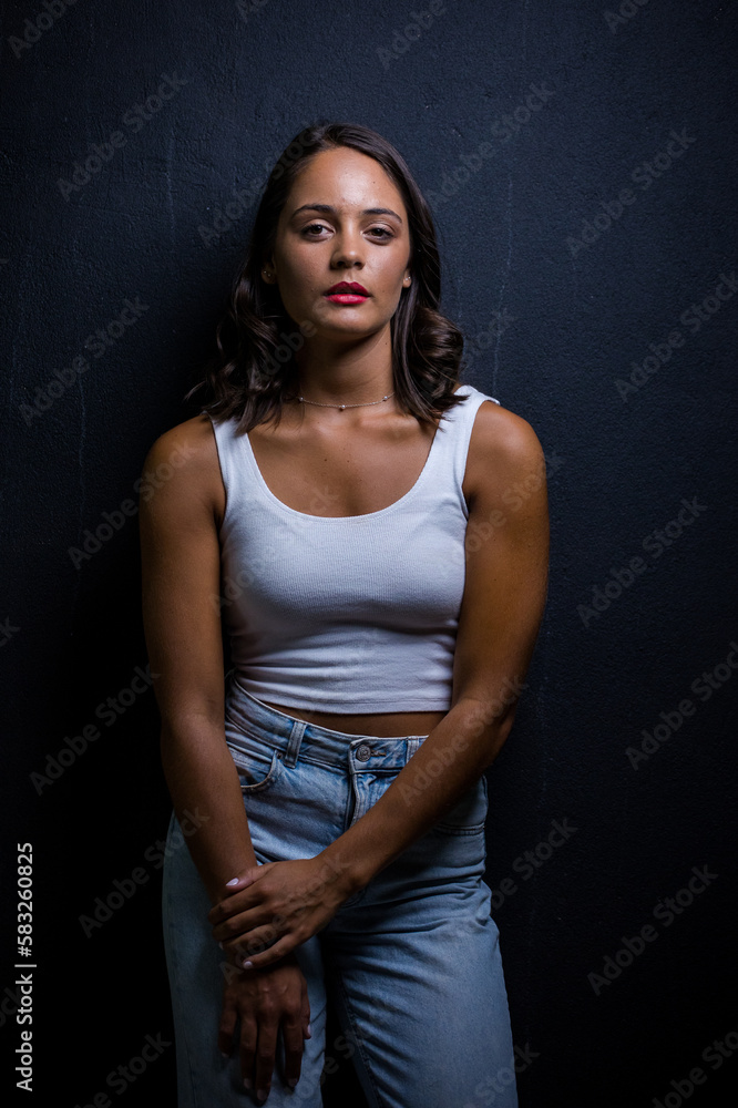 Close up image of a Dark Haired Girl Posing for a Fashion Shoot in a studio Close up image of a Dark Haired Girl Posing for a Fashion Shoot in a studio