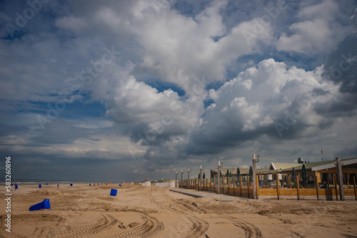 Dramatic cloudy sky over the Katwijk beach photo