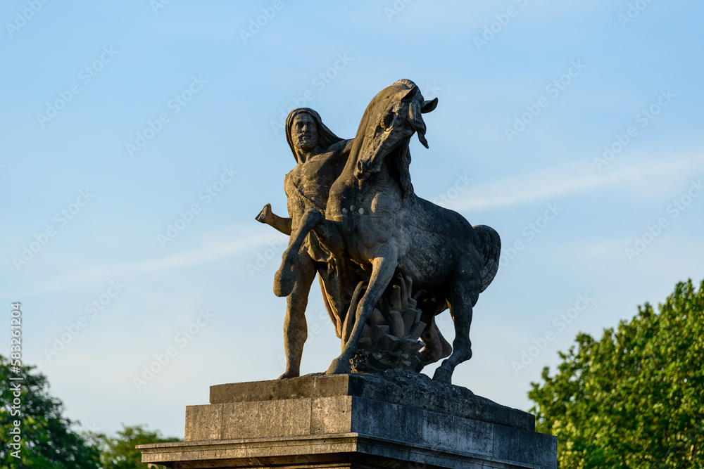Obraz premium A statues of the Pont de Iena , in Europe, in France, in Ile de France, in Paris, At the edge of the Seine, in summer, on a sunny day.
