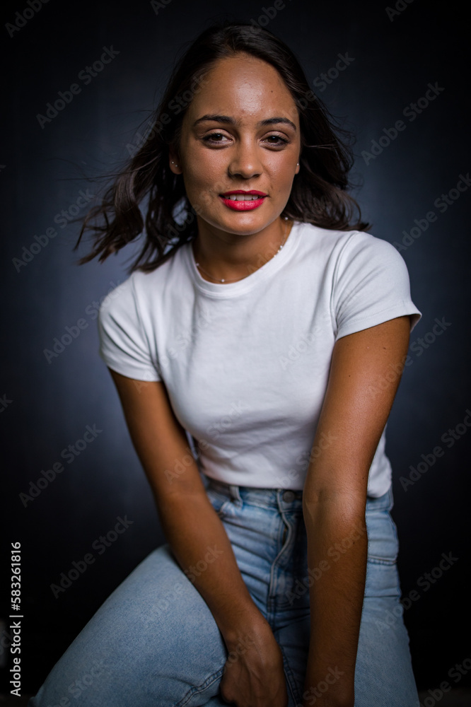 Close up image of a Dark Haired Girl Posing for a Fashion Shoot in a studio Close up image of a Dark Haired Girl Posing for a Fashion Shoot in a studio