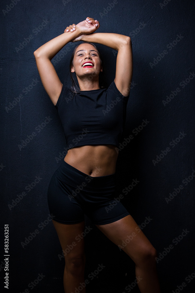 Close up image of a Dark Haired Girl Posing for a Fitness Photo shoot