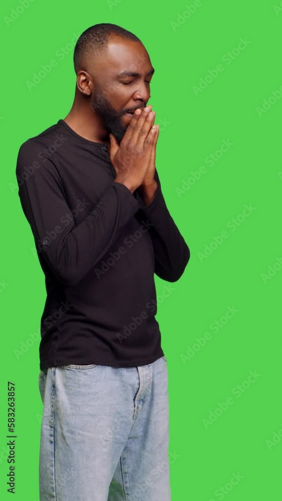 Vertical video: Side view of male person feeling displeased and exhausted in studio, yawning and falling asleep posing over greenscreen backdrop. Casual adult being tired and sleepy, fatigued and Vertical video: Side view of male person feeling displeased and exhausted in studio, yawning and falling asleep posing over greenscreen backdrop. Casual adult being tired and sleepy, fatigued and