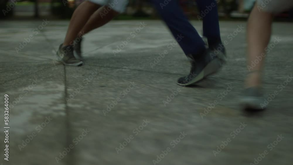 man playing soccer dribbling other people in a square man playing soccer dribbling other people in a square