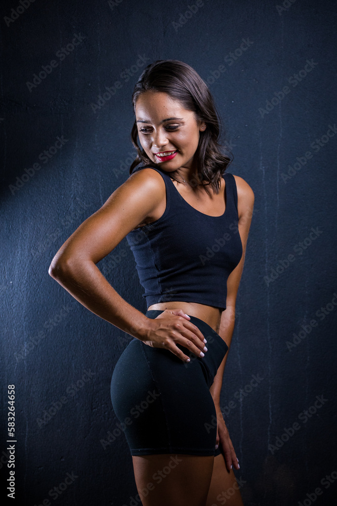 Close up image of a Dark Haired Girl Posing for a Fitness Photo shoot Close up image of a Dark Haired Girl Posing for a Fitness Photo shoot