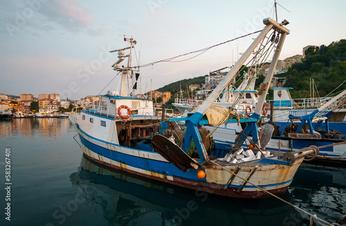 Small fishing boat moored in the port.