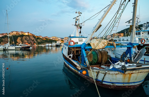 Small fishing boat moored in the port.