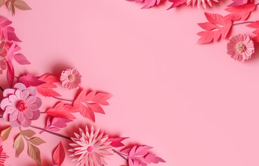Many flowers made of paper on pink background with copy space. Floral frame layout with text space. Romantic feminine composition. Wedding invitation. International Womens day, Mother Day, Birthday